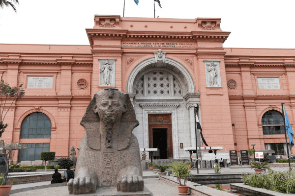Egyptian Museum with a sphinx statue in foreground.