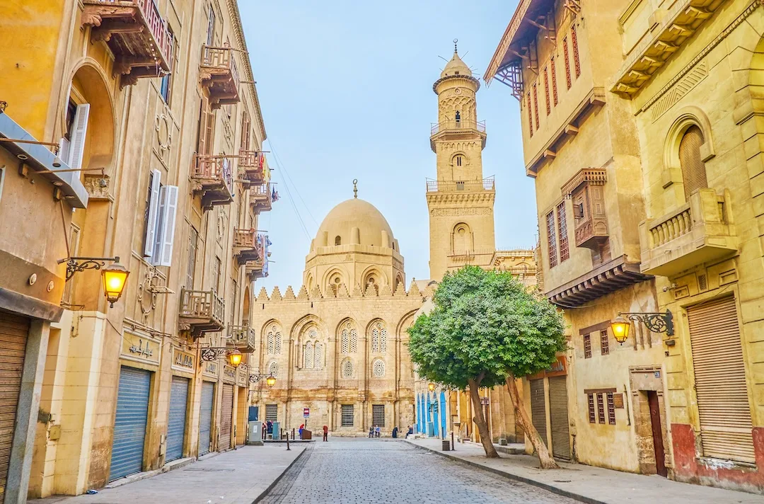 Historic Middle Eastern street leading to grand mosque.