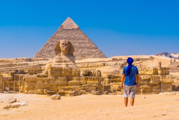 Person gazing at the Sphinx and pyramid