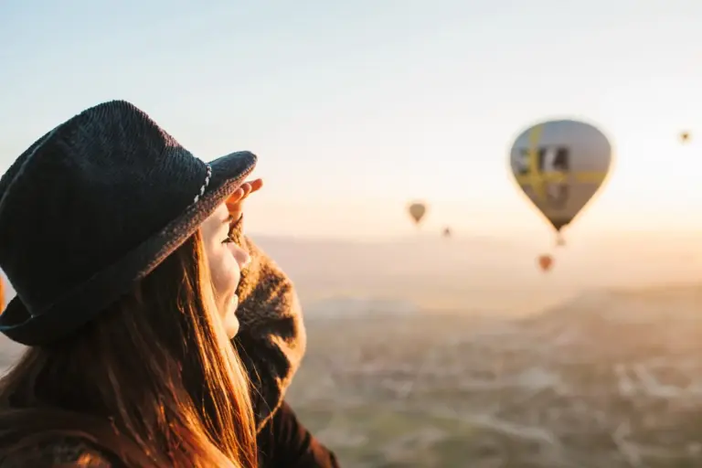 Girl enjoys hot air balloon flight