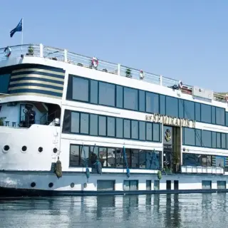 Luxury cruise ship on calm river water