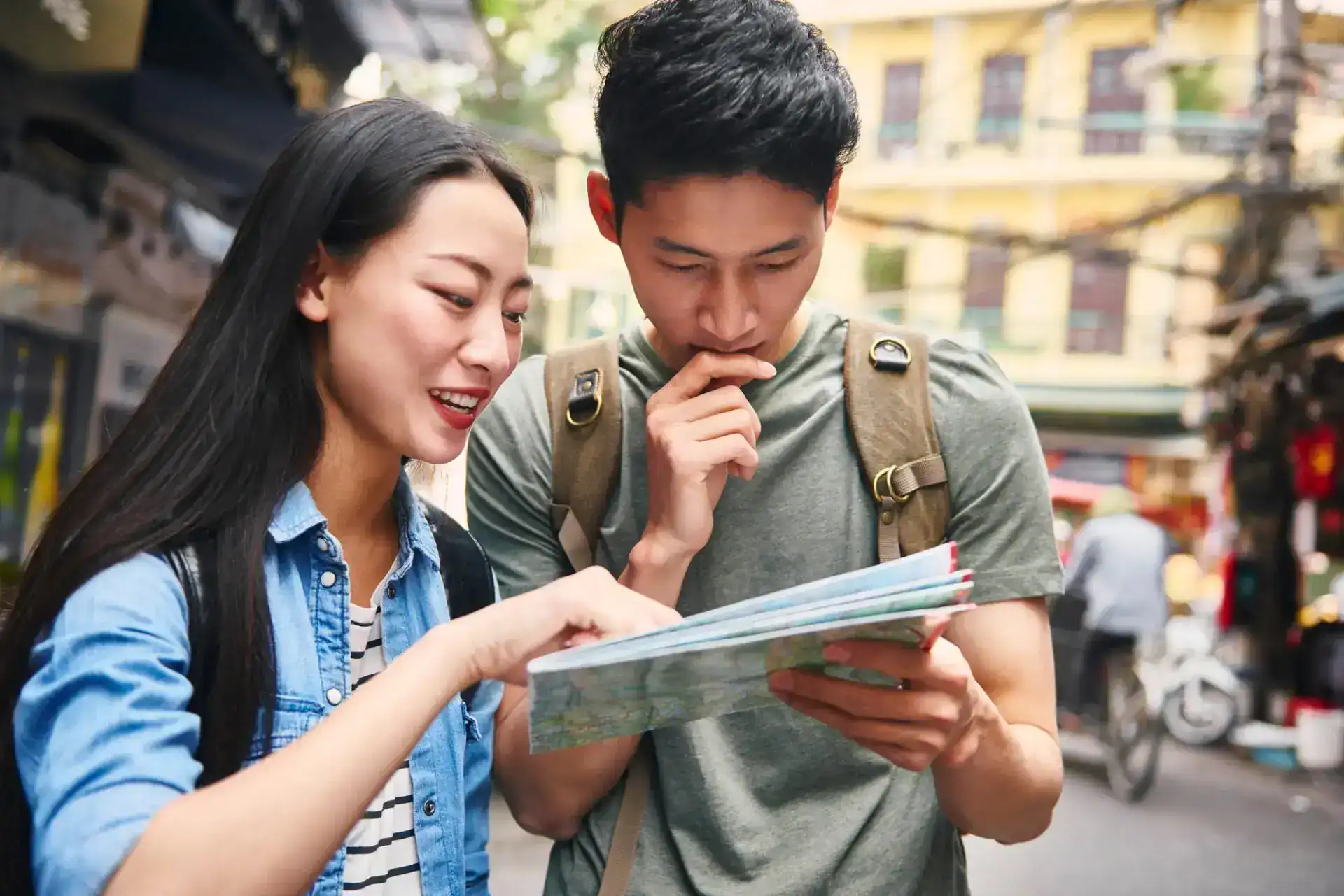 Tourists looking at the directions from map and checking their Best Ways to Tour Egypt Egypt Tours itinerary.