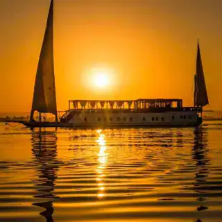 Nile cruise ship at sunset during the 8 Days Cairo and Nile Tour