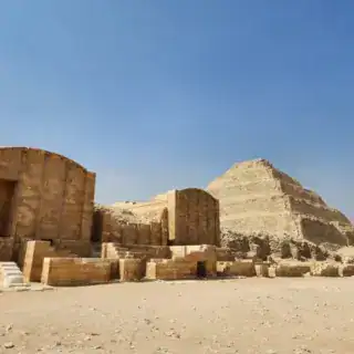 Step pyramids at Saqqara Necropolis in Egypt against the clear blue sky