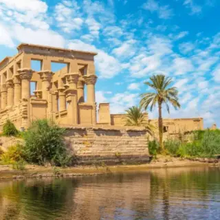 The beautiful temple of Philae and the Greco-Roman buildings seen from the Nile river