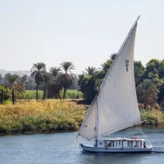 View of a felucca in the nile river, typical small sailboat in the Nile River, Egypt