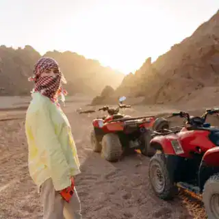 Young girl with a covered face preparing for a desert safari on ATVs Hurghada Desert Safari