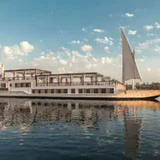 Zahra Dahabiya sailing on the Nile at sunset