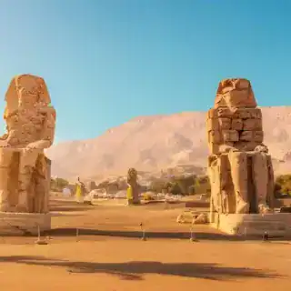 Explore Private Luxor Day Tour from Hurghada and Visit Colossi of Memnon twin stone statues of Pharaoh Amenhotep III standing on Luxor's west bank, Egypt