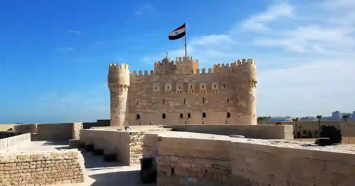 The Citadel of Qaitbay in Alexandria Egypt glowing at sunset over the Mediterranean Sea